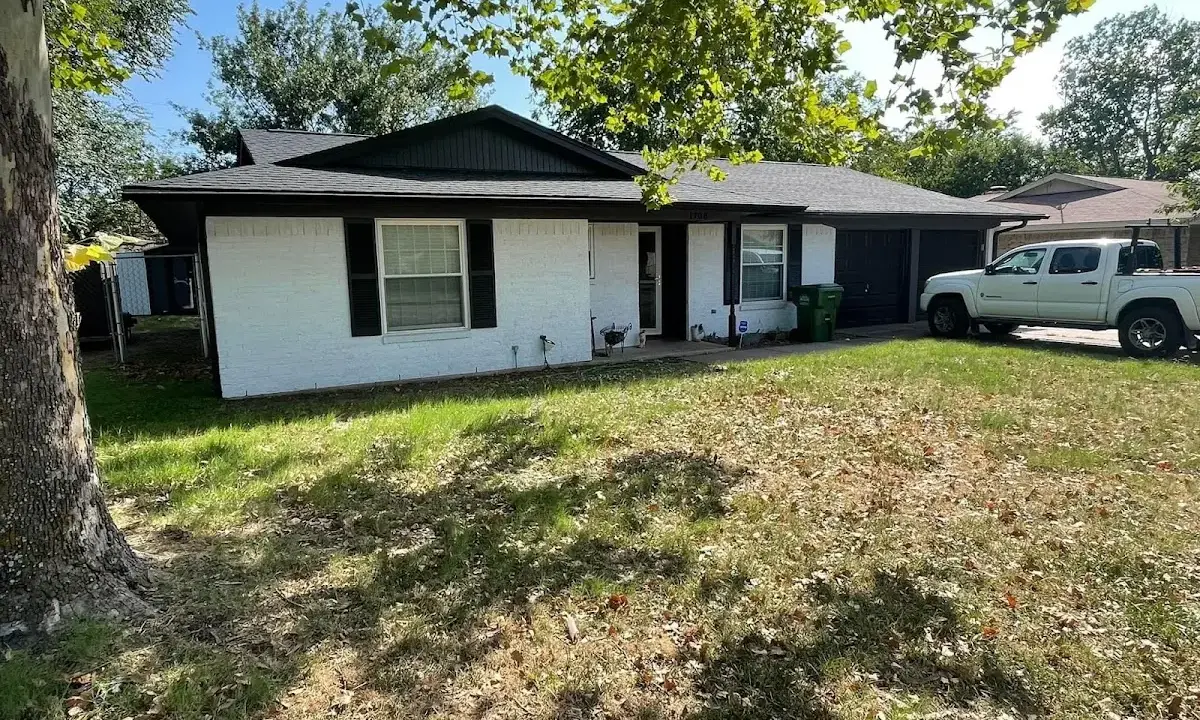 Professional roofing crew working on a residential roof in Discovery Bay